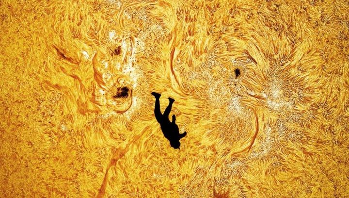 Astrophotographer snaps skydiver falling in front of the sun