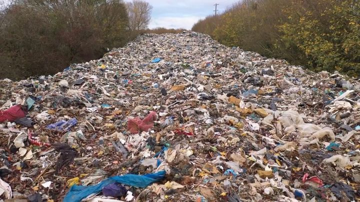 Drone footage shows scale of revolting 60M-long mountain of waste next to river