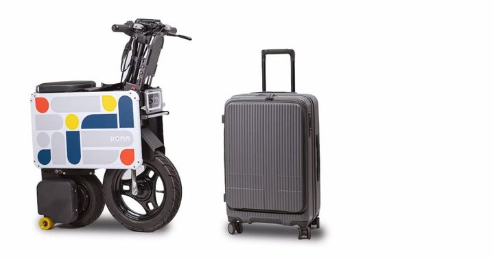Electric motorcycle folds down to the size of a carry-on suitcase