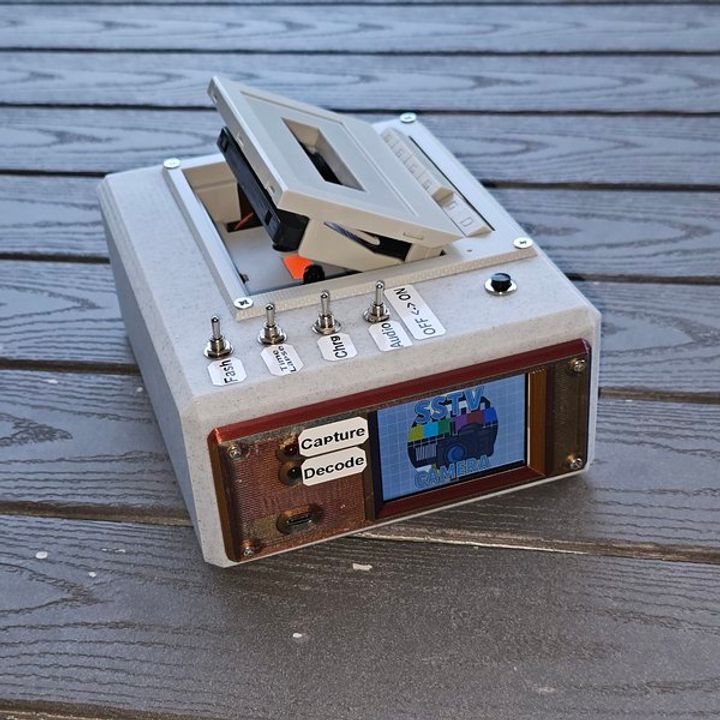 Camera that captures photos to cassette tape