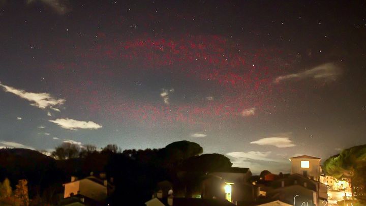 Scientists are baffled as mysterious halo of red light appears over Italian town